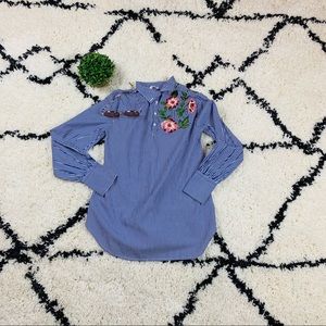 Blue vertical stripped embroidery dip hem blouse